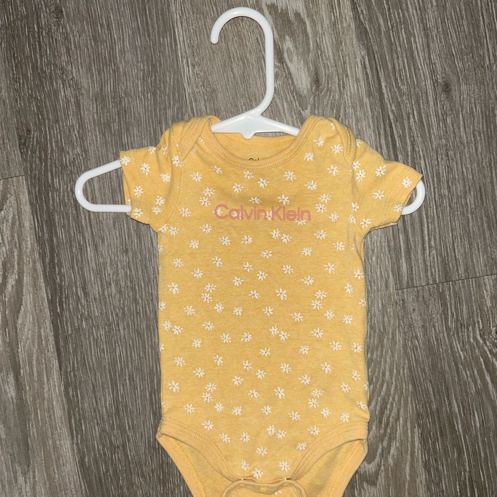Calvin Klein Mustard Floral Baby Bodysuit